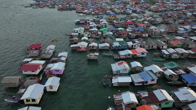 Traditional Bajau Laut Village, Sea Gypsy people in Semporna, Borneo, Malaysia. Stilt Houses Above Sea Waters