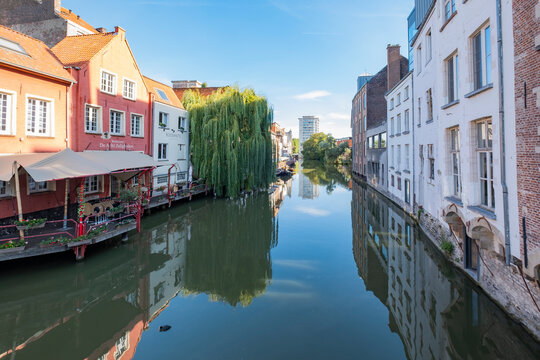 Ghent, Belgium - September 15, 2022: The canals of Ghent are the soul of the city and concentrate much of its medieval charm. River Lys (Leie)Ghent,Gent. City center, old buildings