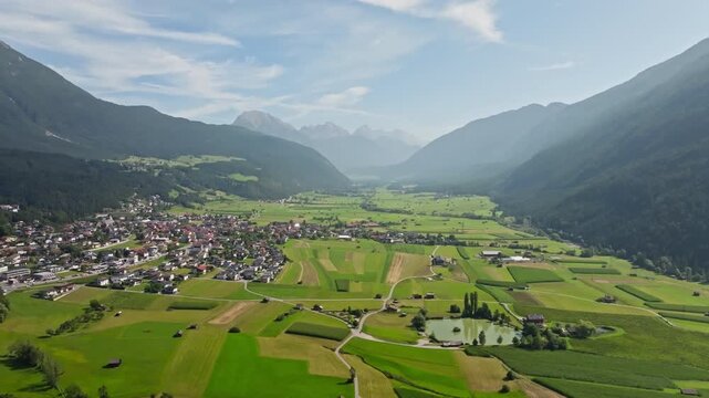 Drone panorama of Tarrenz Tyrol Austria showcasing charming alpine village architecture beautiful mountain landscapes and tourism in Europe