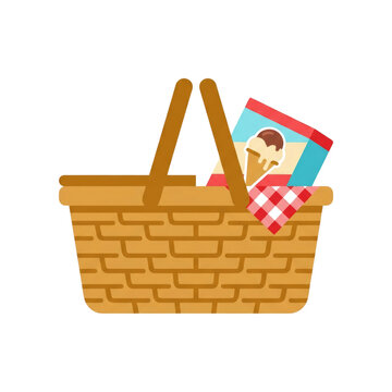 Wicker picnic basket filled with ice cream cone packaging and checkered blanket for outdoor eating