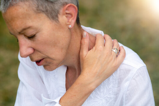Gentle neck self healing exercise focused on relieving stress and tension through mindful touch, relaxation techniques, and holistic energy balancing practices.