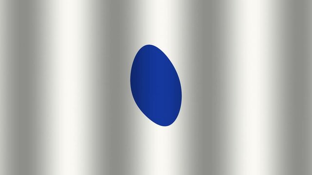 Flag with blue circle on silver background waving in the wind