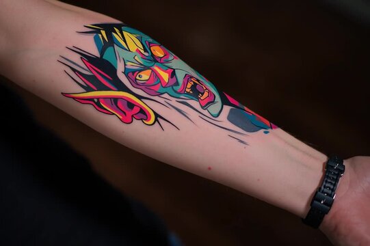 Colorful anime style tattoo on a forearm, vibrant body art, modern tattoo culture, self expression and creative illustration concept