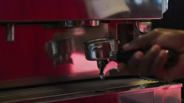 espresso machine pouring espresso. Crop image of a young male barista pouring hot milk into hot espresso black coffee for making. 