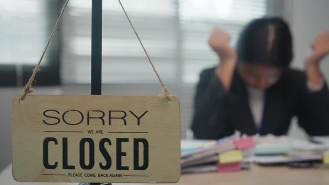 Closed Business Sign with Stressed Small Business Owner Facing Financial Pressure