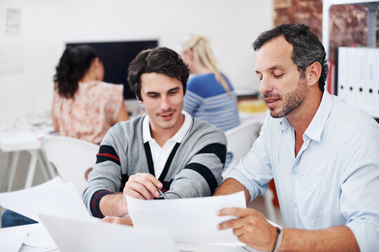 Team, documents and smile with business people in office for planning, interior design pitch and feedback. Decor paperwork, client briefing and meeting with employees for research and project