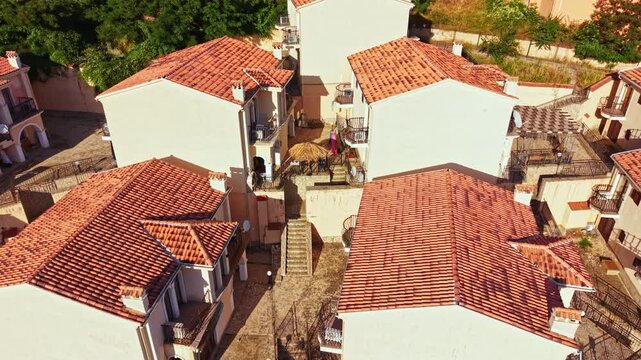 Elenite city shows damage from a recent flood with buildings surrounded by water and mud. Streets appear affected with debris scattered around the area. Recovery efforts may begin soon.
