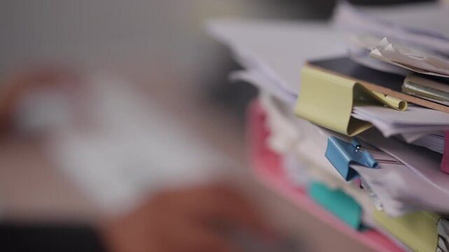 Organized Business Documents with Color Tabs on Office Desk