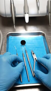 Dental Tools Displayed on Tray with Blue Cover in Dental Clinic Environment, Highlighting Precision Instruments for Oral Examination and Treatment
