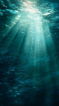 Underwater sunlight rays penetrating ocean surface, clear blue water, marine life, water movement, swimming, aquatic environment, nature