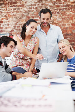 Documents, team and laptop with business people in office for interior design, planning and blueprint review. Architect briefing, proposal feedback and brainstorming with employees in creative firm