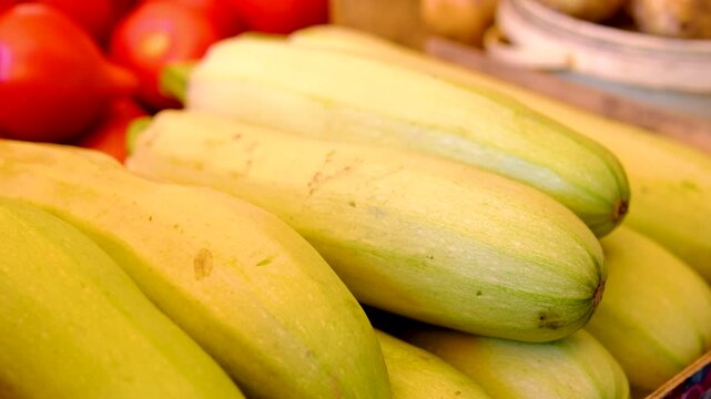 zucchini in the market. Fresh healthy green zucchini courgettes cucumber in brown wooden box