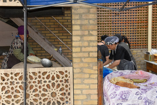 Womans cooking breads at Khiva in Uzbekistan