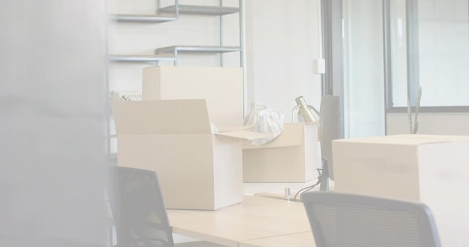 Scan lines fading and clearing, revealing packed office desks, boxes, lamp preparing relocation