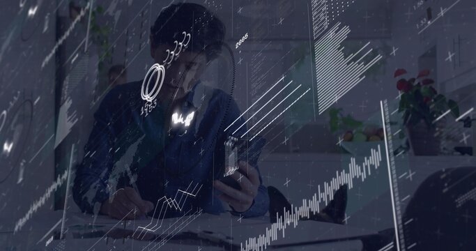 Data arriving, seated pro consulting phone and noting while analyzing charts sliding up to gains