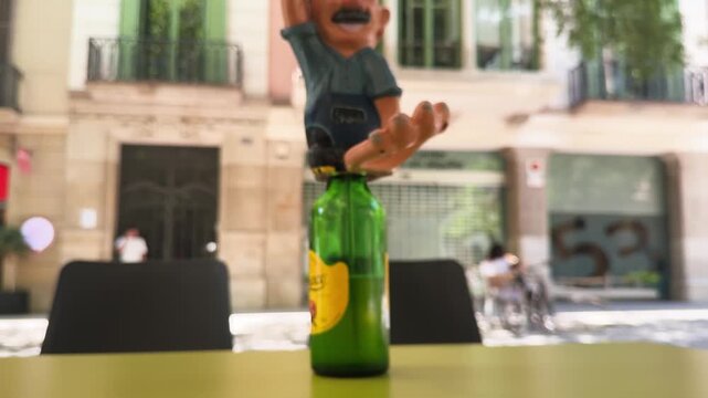 Close-up of toasting with glasses of traditional Asturian cider at an outdoor cafe. Casual social gathering, local Spanish culture, friendship, celebration. High quality 4k footage