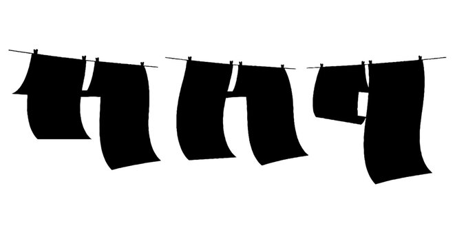 Black shirts hanging on a clothesline in a row.