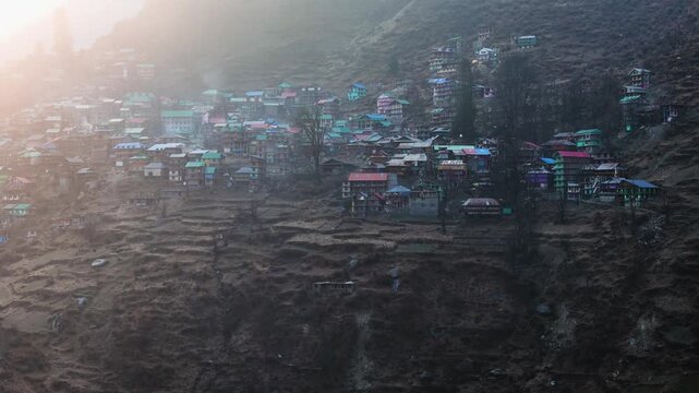 Scenic Aerial View of Malana Village in Himachal Pradesh Surrounded by Majestic Himalayan Mountains, Traditional Wooden Houses, Green Valley, Dense Forest, Remote Mountain Settlement and Beautiful Nat