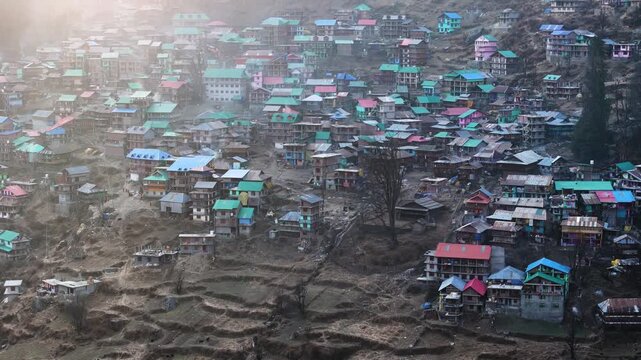 Scenic Aerial View of Malana Village in Himachal Pradesh Surrounded by Majestic Himalayan Mountains, Traditional Wooden Houses, Green Valley, Dense Forest, Remote Mountain Settlement and Beautiful Nat