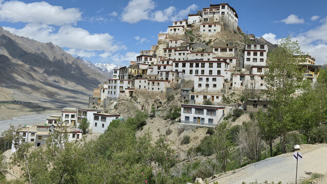 Spectacular panoramic view of Key Monastery overlooking Spiti Valley beneath bright Himalayan skies.