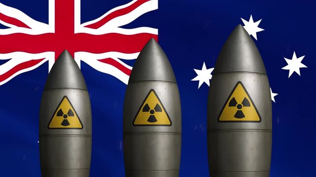Nuclear missiles with radiation warning symbols against waving australian flag background, warhead