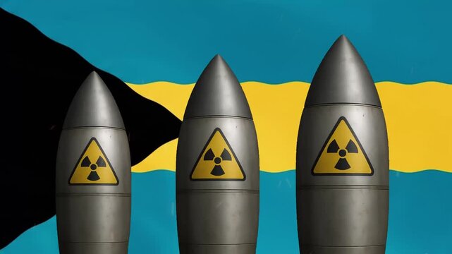 Nuclear missiles with radiation warning symbols against waving bahamas flag background, warhead