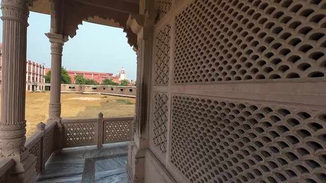 Traditional Sandstone Lattice Window Jali Work Along a Beautiful Temple Gallery Corridor