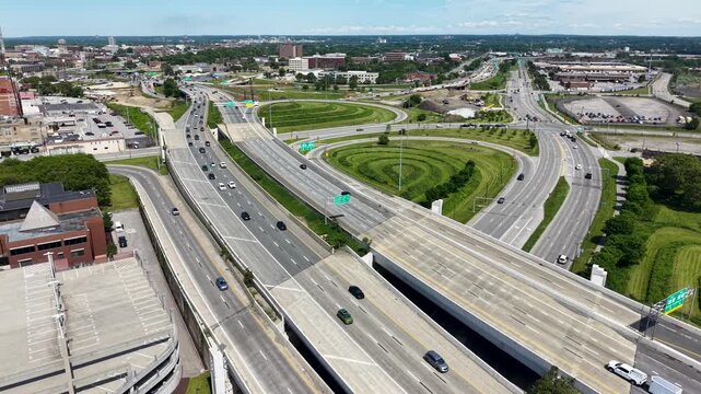Aerial footage of cars driving on the highway in downtown Cleveland Ohio USA