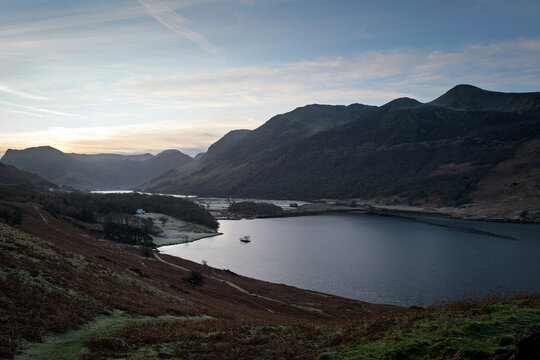 Views across Rannerdale, Crummock Water and summits of Fleetwith Pike, High Stile and Red Pike in the Lake District at dawn in Cumbria, England UK.