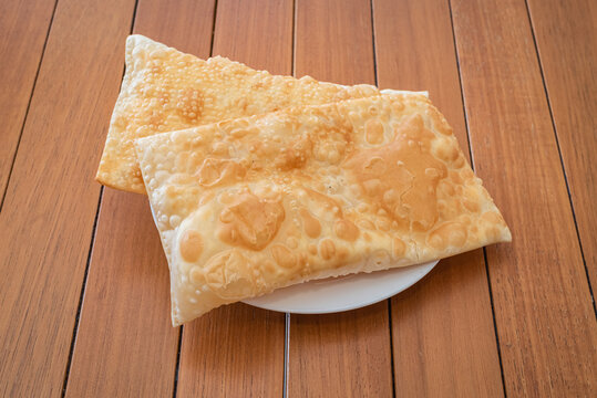 Brazilian pastel pastries on white dish
