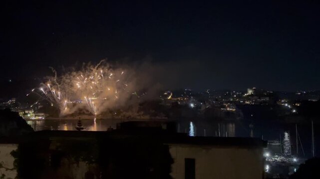 From the viewpoint of Capo Miseno in Bacoli, fireworks go off from the sea