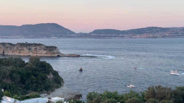 a romantic sunset with the view of Bacoli seen from the Capo Miseno promontory