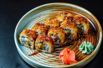 front view fried sushi with red fish with wasabi and ginger on a plate © William