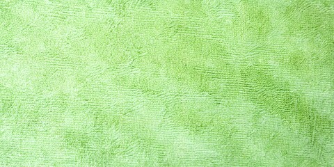 Lime green soft fleece fabric texture with wave detail © MD