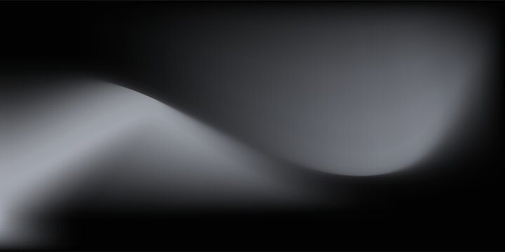 Sandblasted or brushed titanium or steel metal surface, the light reflection of the curved lines creates a smooth gradation on the dark black metallic background