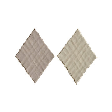 Two quilted diamond shaped fabric samples with cross stitched pattern stitched isolated background geometric material abstract composition materiality symmetry decoration