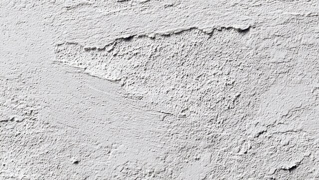 Closeup of textured white plaster wall surface for background or design inspiration