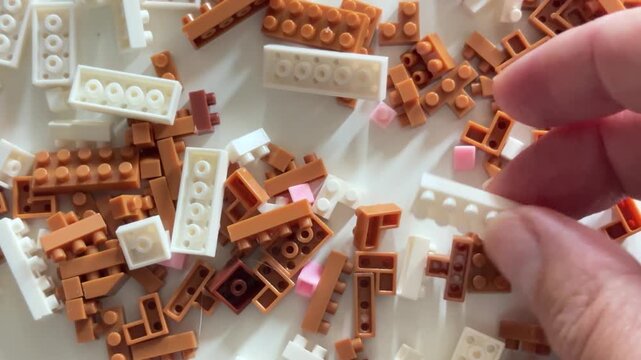 Toy bricks scattering on a desk for childhood and creativity concept
