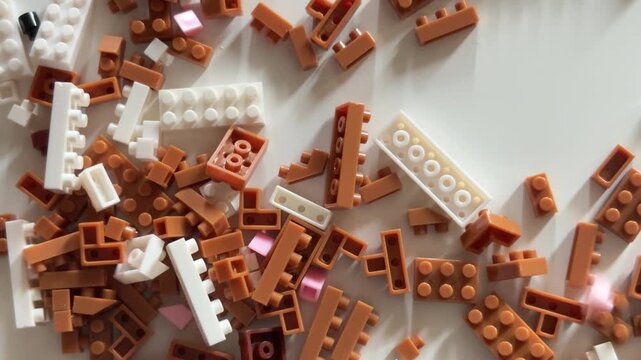 Toy bricks scattering on a desk for childhood and creativity concept
