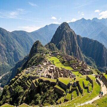 Machu Picchu, Peru, ancient Inca ruins, mountain landscape, green grass, blue sky