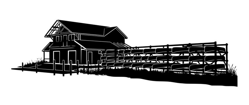 Silhouette of a lakeside boathouse with a large canoe storage rack