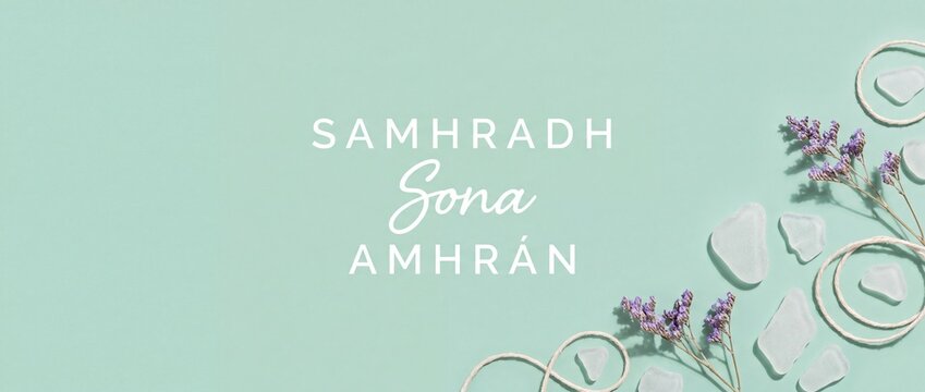 Irish summer greeting card banner with text Samhradh Sona Amhr&aacute;n, featuring sea glass, dried purple flowers, and rustic rope on mint green background for a calm, coastal aesthetic concept.