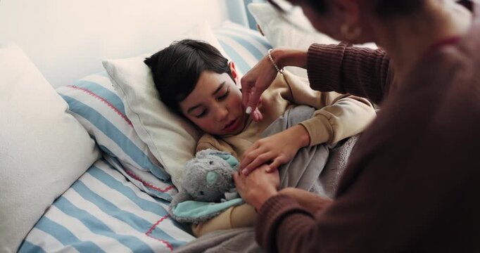 Woman, bedroom and sick child with touch for fever, flu or high temperature with help in family home. Boy kid, ill son and mother with support for wellness, recovery or healing with concern or worry