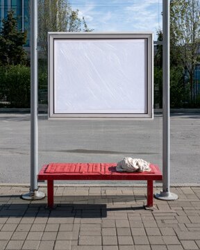 Empty Bus Depot Bench with Blank Timetable Display and Cleaning Cloth