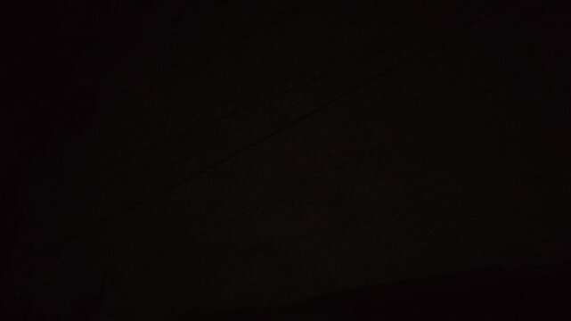 Night Sky Featuring A Single Bright Lightning Bolt Striking Through Dark Clouds During A Heavy Storm