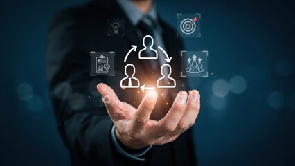 Obraz premium Businessman hand holding a digital network icon representing human resource management