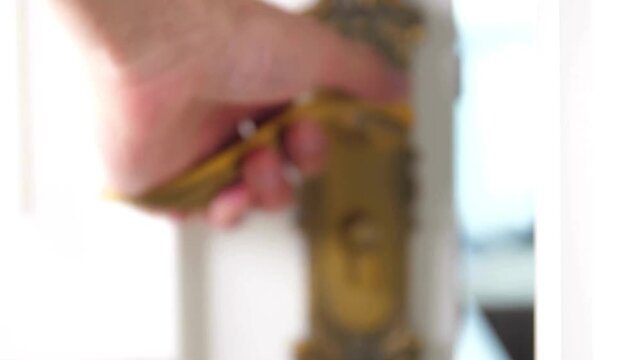 Hand, turning, old, brass, door handle, close-up