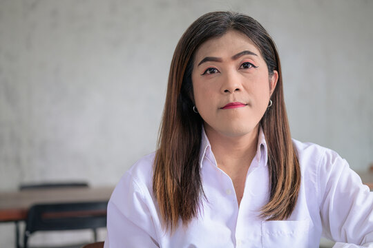 Close up Portrait of a Thai Transgender Businesswoman Looking at Camera