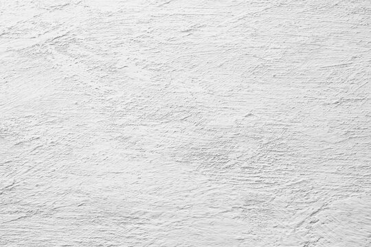 Light gray plaster texture with rough surface and subtle relief pattern. Neutral abstract background for design, branding, presentations, mockups and architectural concepts