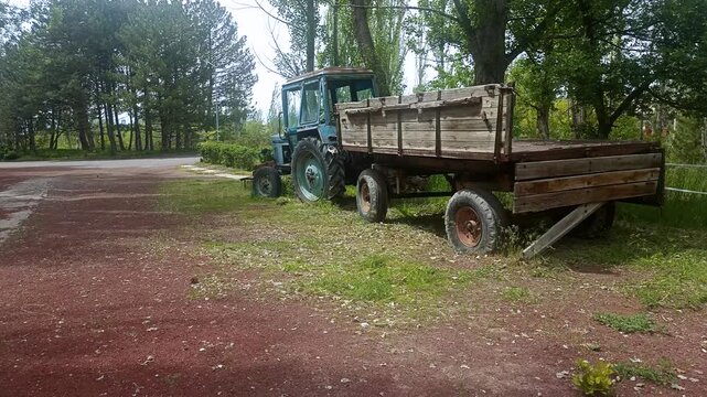 Abandoned old rusty tractor in the forest